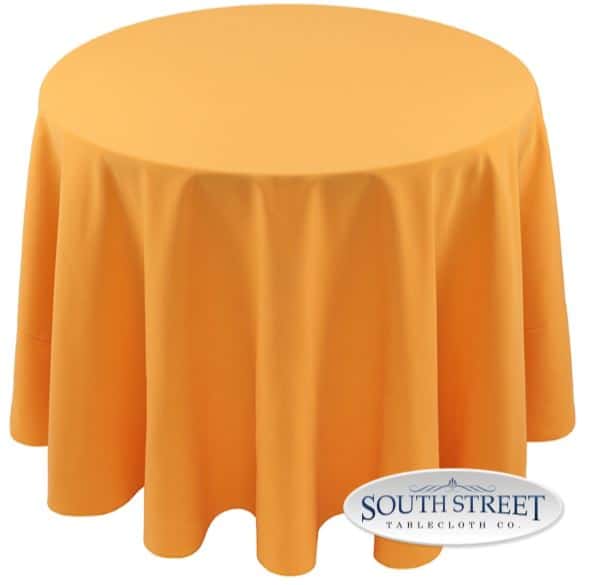 A table with a gold-colored cover