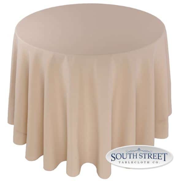 A table with a beige cover