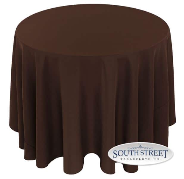 A round table with a brown cloth