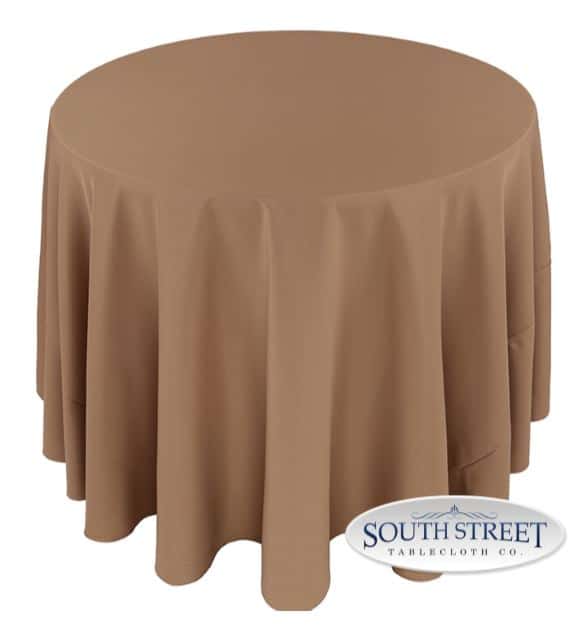 A table with a khaki-colored cover